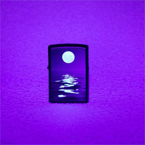 front of zippo on display under blacklight