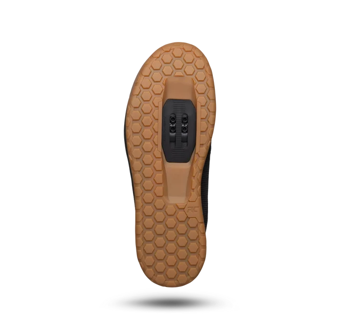 Brown shoe sole with a textured pattern on a white background