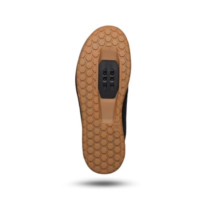 Brown shoe sole with a textured pattern on a white background