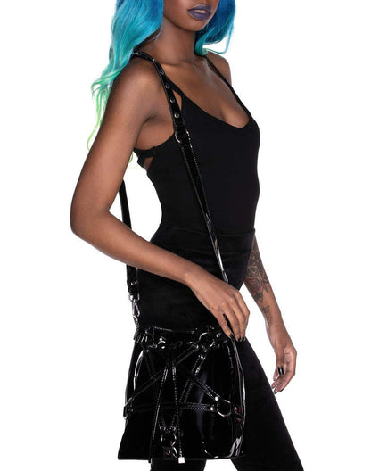 model holding handbag
