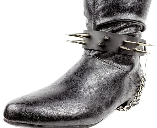 black boot displaying black boot strap  that has two rows of multiple silver sharp pointy spike studs and hanging silver chain