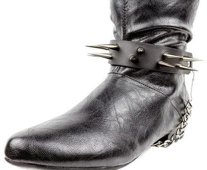 black boot displaying black boot strap  that has two rows of multiple silver sharp pointy spike studs and hanging silver chain