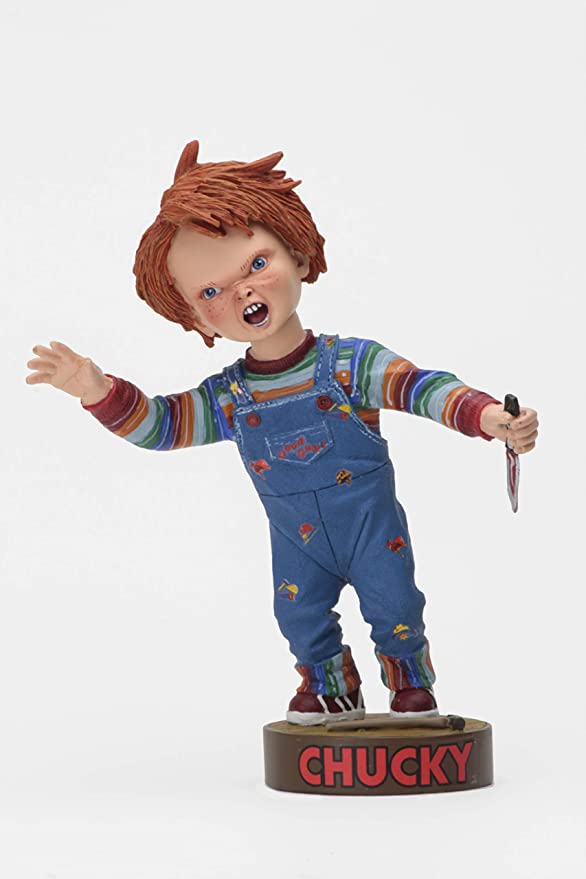 front of Head knocker bobble head of Chucky from Child's Play 2. Chucky has his right hand up, mouth open as if he is yelling, and in his left hand is clutching a knife. Chucky stands on a small round platform that reads "CHUCKY" in red letters on the front.