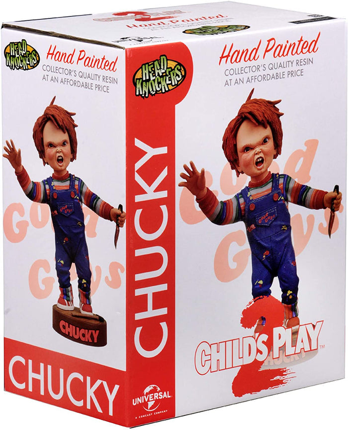 box of Head knocker bobble head of Chucky from Child's Play 2. Chucky has his right hand up, mouth open as if he is yelling, and in his left hand is clutching a knife. Chucky stands on a small round platform that reads "CHUCKY" in red letters on the front.