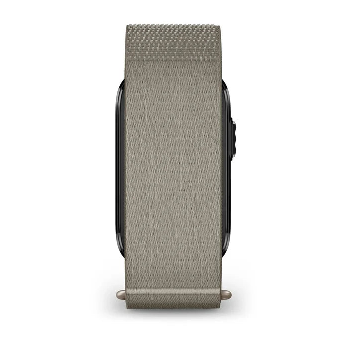 A light gray woven fabric watch band attached to a smartwatch, shown from the side against a plain white background.