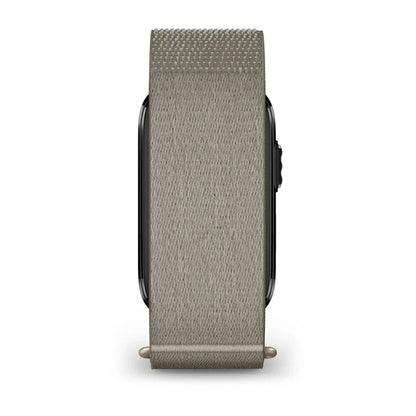A light gray woven fabric watch band attached to a smartwatch, shown from the side against a plain white background.