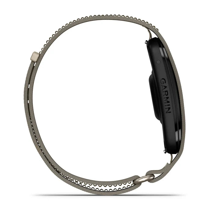 A side profile view of a Garmin smartwatch with a dark gray metallic loop band on a solid white background.