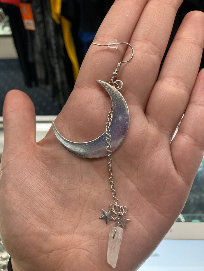 model holding earring