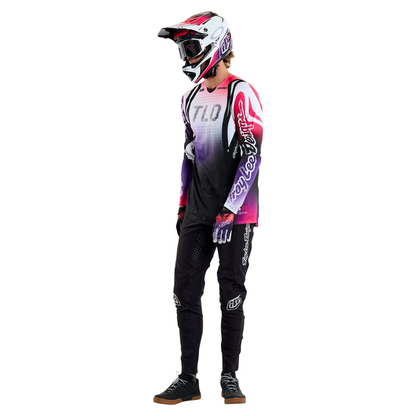 Person wearing a mountain biking outfit with a helmet on a white background