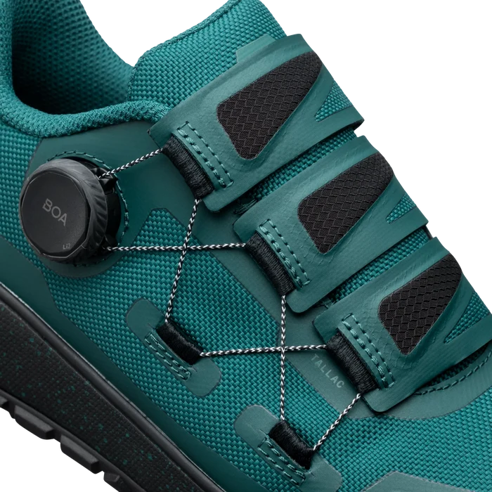 Teal hiking shoe with BOA system on a white background