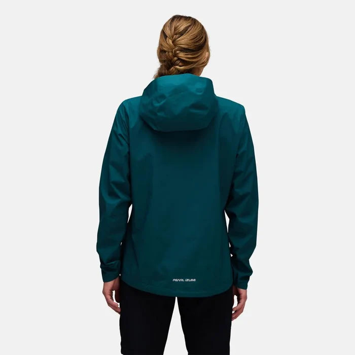 Person wearing a teal jacket on a white background